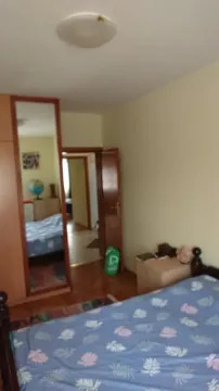 Furnished bedroom with a double bed, wardrobe, and a view of the hallway. - image 6