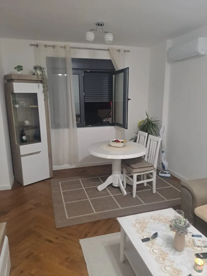 Living room with a dining table and furniture.
