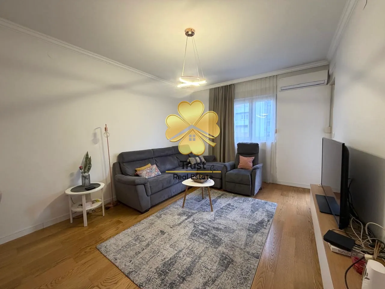 Living room with sofa and TV.