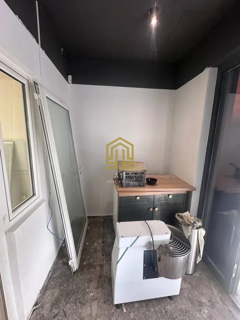 An unfinished interior space with construction materials and equipment.