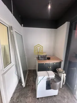 An unfinished interior space with construction materials and equipment. - image 6