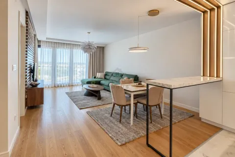 Living room with dining area and modern furniture. - image 15