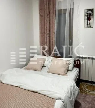 Furnished bedroom with a double bed. - image 6