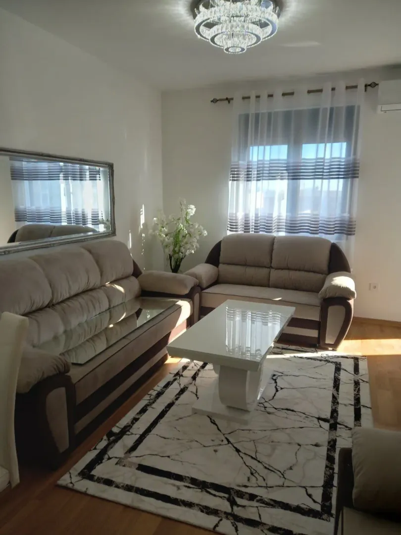 Bright living room with a sofa set and a coffee table.