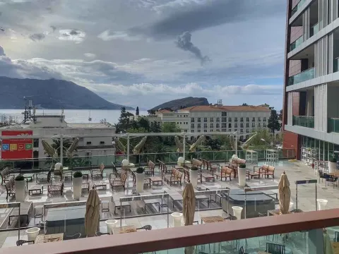 Large terrace with seating furniture and a view of the sea and surroundings. - image 10