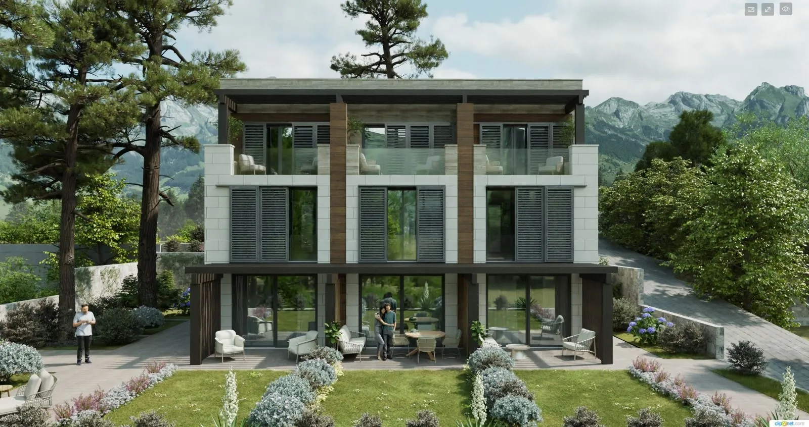 Eksterijer moderne stambene zgrade sa uređenim dvorištem i planinskim pejzažom u pozadini.