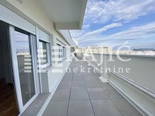Spacious terrace with a city view.