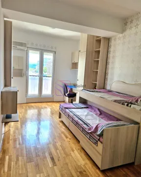 Children's bedroom with a pull-out bed, wardrobe, and a desk. - image 18