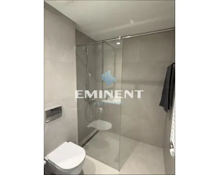 Modernly equipped bathroom with a walk-in shower and built-in sanitary ware. - image 11