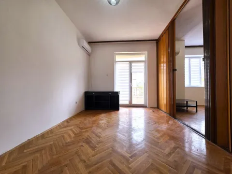 Empty living room with parquet flooring, air conditioning unit, and access to the balcony. - image 4