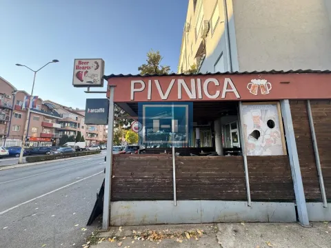 Exterior of the commercial space and pub with a sign by the street. - image 2