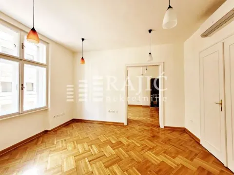 Empty room with parquet flooring and white walls. - image 14