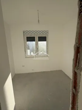 Empty room under construction with a window. - image 5