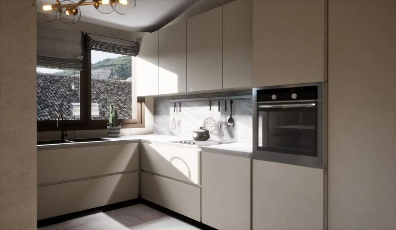 Modern kitchen with built-in appliances and a window view.