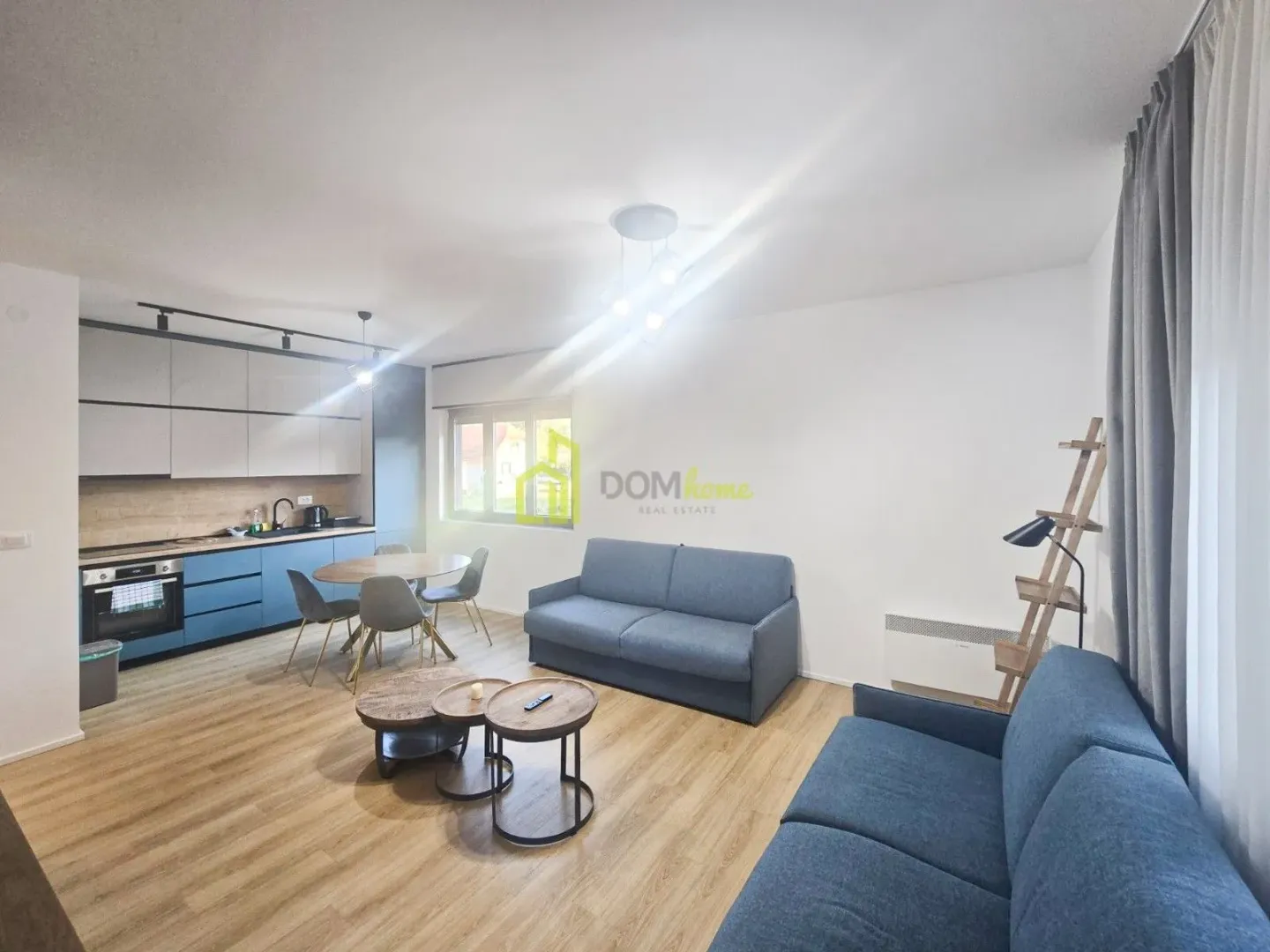 Open plan living room with kitchen and dining area.