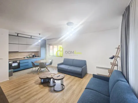 Open plan living room with kitchen and dining area. - image 8