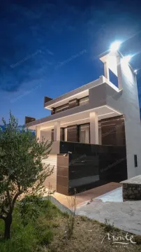 View of a modern villa with lighting at dusk. - image 22