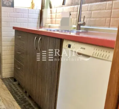 A view of part of the kitchen with a sink and countertops. - image 10