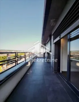 Spacious covered terrace with metal railing and views of the surroundings. - image 28