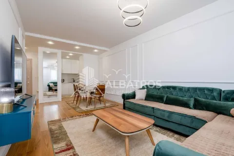 Spacious living room with a sofa set and a dining area beyond. - image 2