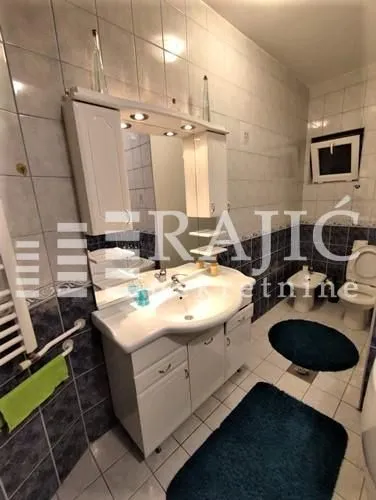 Small bathroom with a sink, mirror, and bathroom fixtures.