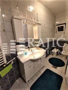 Small bathroom with a sink, mirror, and bathroom fixtures. - image 3