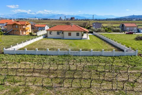 Aerial view of a single-story house with a fenced yard and vineyard in the suburbs. - image 10