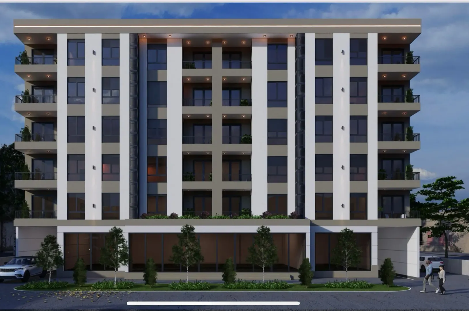 Exterior view of a modern residential building with balconies.