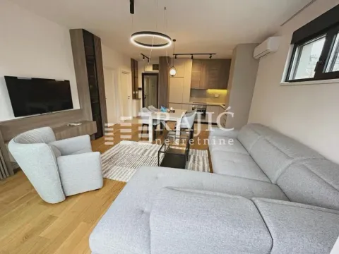 Modern living room connected to the dining area and kitchen. - image 2