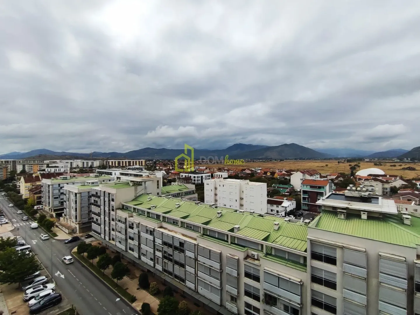 View from the apartment overlooking the urban area and surrounding mountains.
