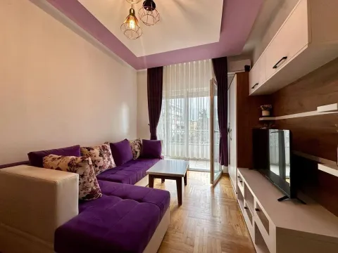 Living room with sofa and TV unit. - image 2
