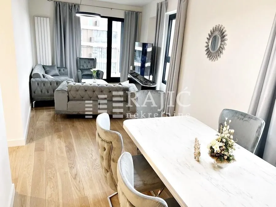 Living room with dining area and seating furniture.