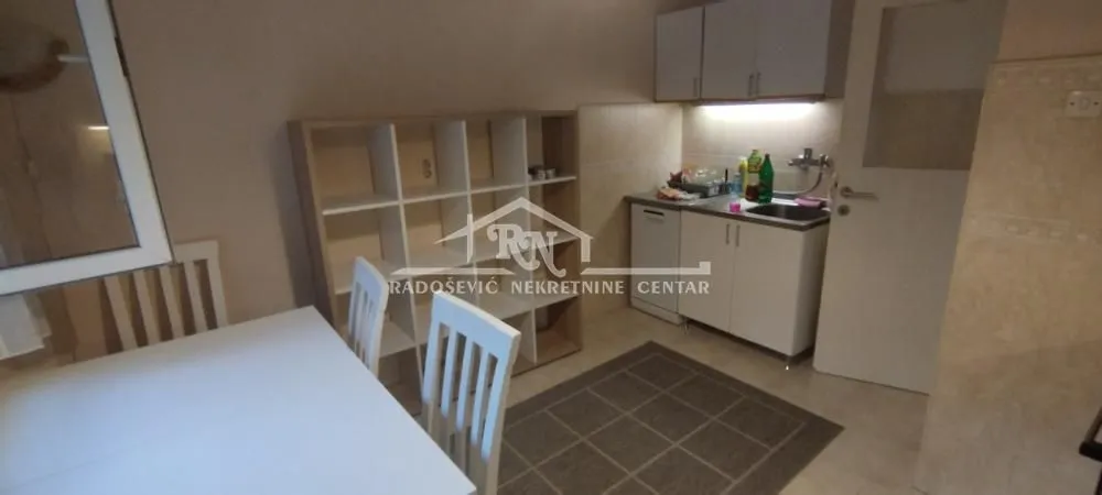 Smaller kitchen connected with the dining area.