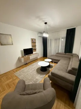 Living room with a sofa set, armchair, TV cabinet, and parquet flooring. - image 12
