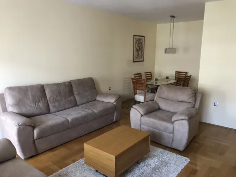 Bright living room with a sofa set and a dining table. - image 6