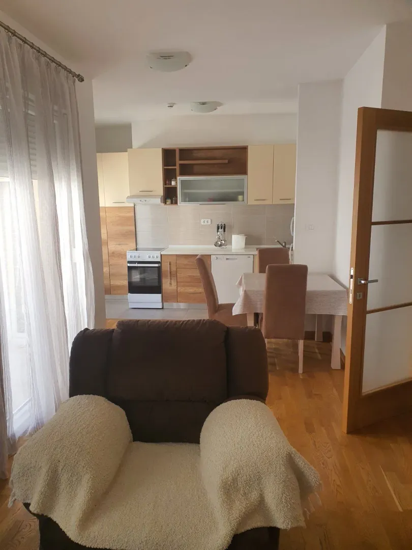 Living room with a view of the kitchen and dining area.