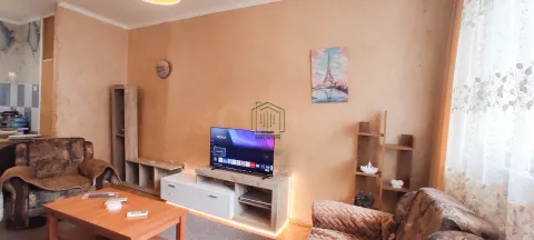 Furnished living room with a sofa set, television, and coffee table. - image 3