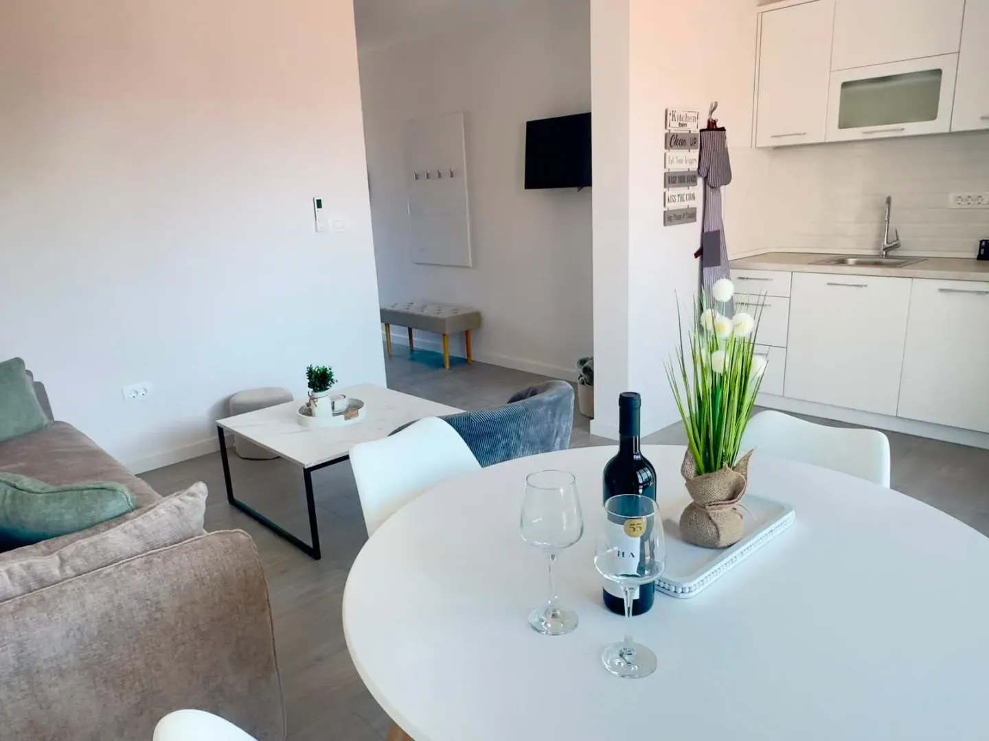 Open-plan living room with dining area and kitchen.