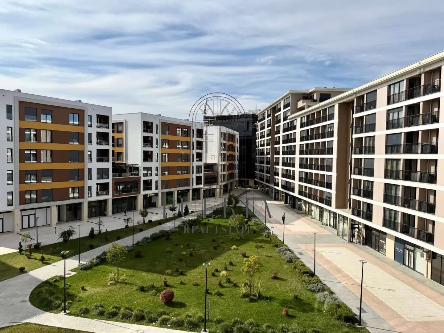 View from the terrace facing the courtyard and residential building facade.