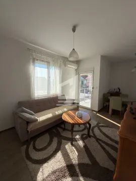 Living room with sofa, coffee table and access to the terrace. - image 2