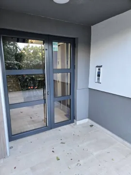 Entrance door of a building with an intercom. - image 8