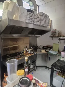 Commercial kitchen with stainless steel elements and catering equipment. - image 13