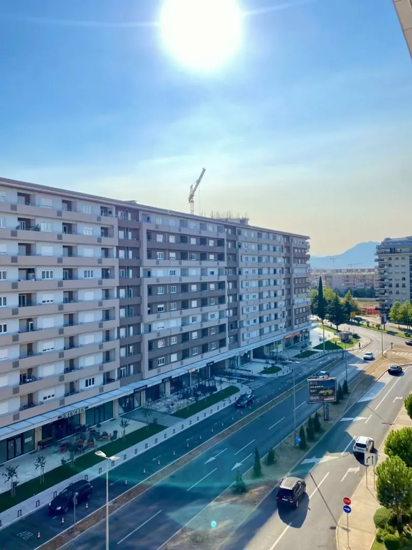 View from the terrace of the city street and surrounding residential buildings.