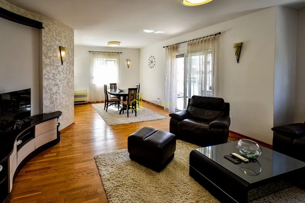 Spacious living room with seating area and dining space.
