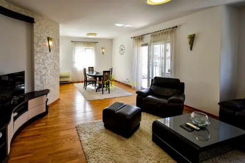 Spacious living room with seating area and dining space. - image 7