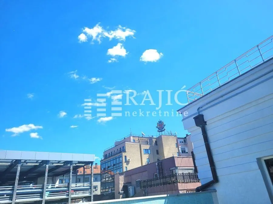 View of a part of the building and surrounding structures from the terrace.