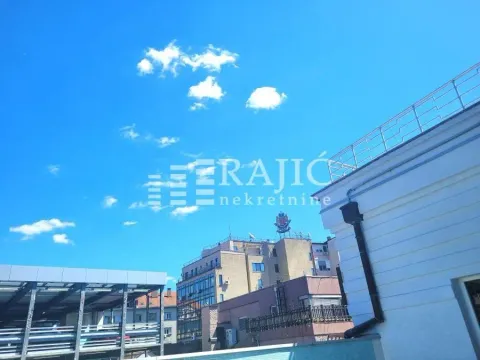View of a part of the building and surrounding structures from the terrace. - image 5