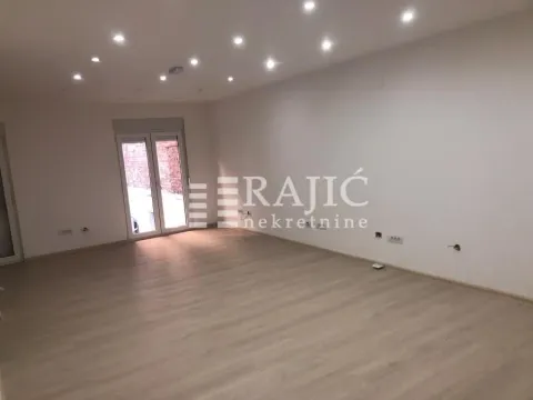 Empty room with laminate flooring and recessed lighting. - image 10