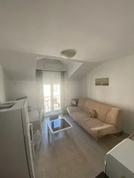 Living room with a sofa, coffee table, and access to the terrace. - image 5
