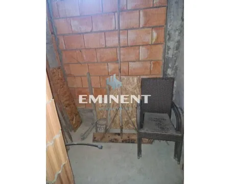View of a room under construction with brick walls and a chair. - image 4